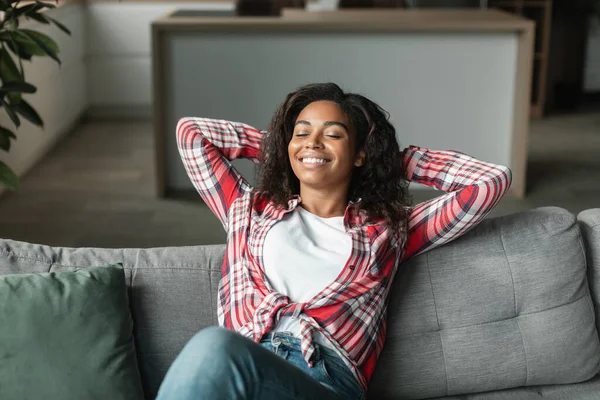 Smiling Pretty Black Young Woman Closed Eyes Rest Alone Sofa — Stock Photo, Image