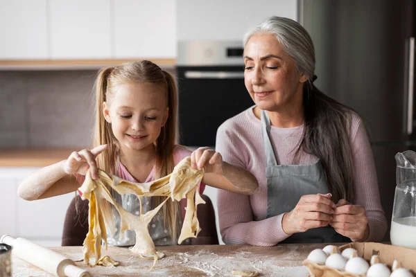Cheerful Caucasian Little Granddaughter Elderly Grandmother Make Cookie Dough Enjoy — Stock Photo, Image