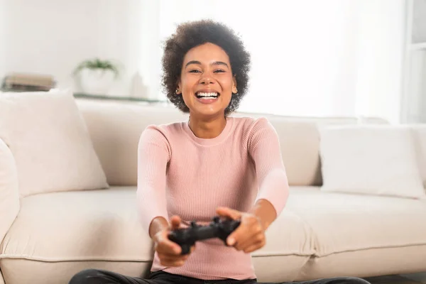 Having Fun at Home. Cheerful Black Teen Guy with Joystick Playing Online  Computer Games, Sitting on Couch Indoors Stock Image - Image of computer,  person: 227478857