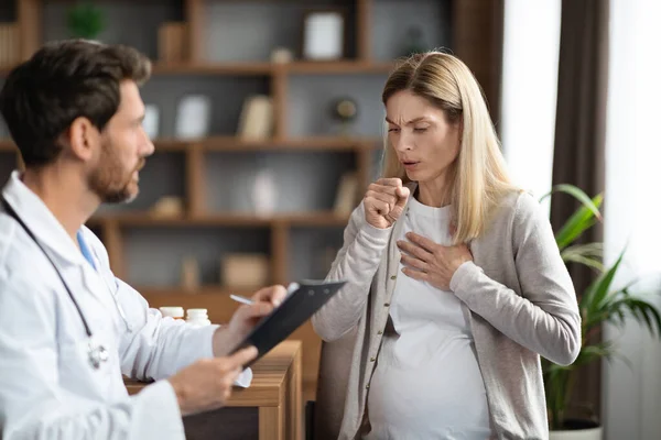 Sick Pregnant Woman Coughing Meeting Doctor Clinic Male Therapist Clipboard — Stock Photo, Image