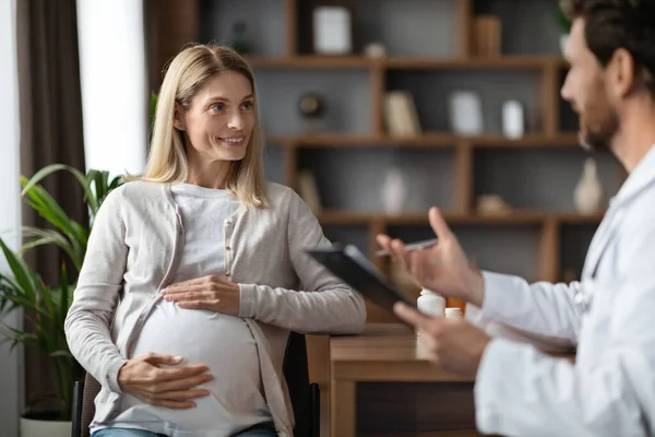 Smiling Pregnant Woman Getting Medical Consultation Gynecologist Clinic Male Doctor — Stock Photo, Image