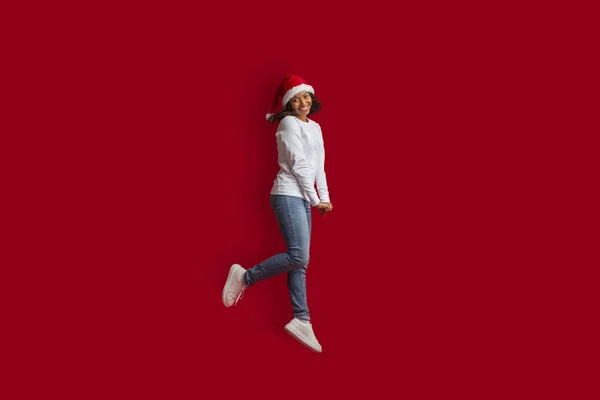 Cute Attractive African American Millennial Woman Casual Santa Hat Jumping — Stock Photo, Image