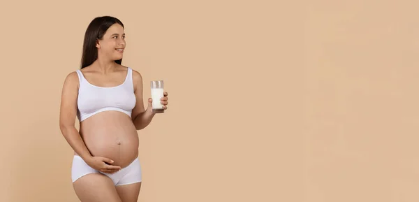Beautiful Pregnant Woman Holding Glass Milk Looking Aside Copy Space — Stok Foto