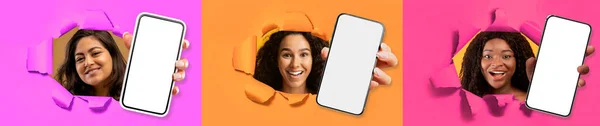 カラフルな紙の壁と笑顔で引き裂かれた穴をスマートフォンを示す3つの陽気な若い多民族の女性は 白い空の画面でガジェットを保持し 広告のためのモックアップ 写真のセット コラージュ — ストック写真
