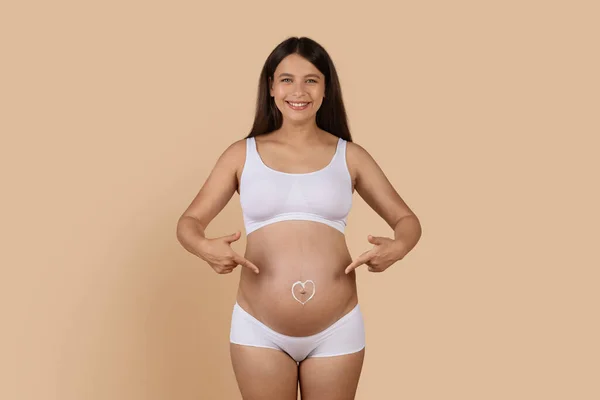 Happy Pregnant Female Underwear Pointing Heart Shape Made Cream Her — Stok Foto