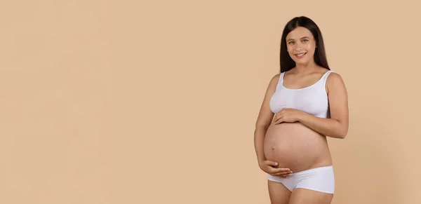 Portrait Beautiful Smiling Pregnant Lady White Underwear Embracing Belly Looking — Stok Foto