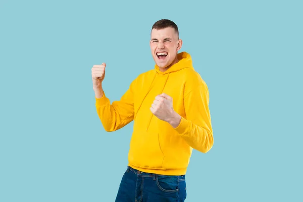 Overjoyed Caucasian Man Shouting Shaking Fists Celebrating Big Success Blue — Stock Photo, Image