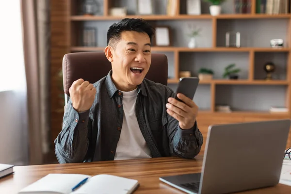 Happy Middle Aged Japanese Businessman Open Mouth Looking Smartphone Making — Stock Photo, Image