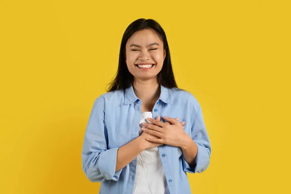 Cheerful Cute Millennial Asian Lady Syndrome Casual Presses Hands Chest — Stock Photo, Image