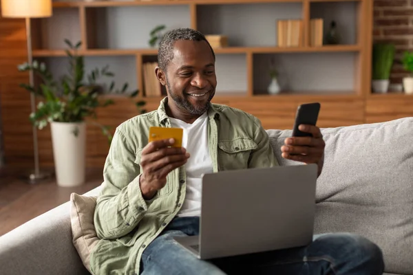 Cheerful Middle Aged African American Man Sit Sofa Laptop Uses — Stock Photo, Image
