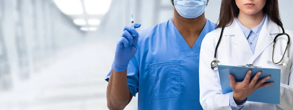 Medical Banner Two Multiethnic Doctors Wearing Uniform Posing Hospital Hall — Stock Photo, Image