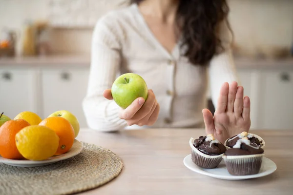 Junk Food Woman Refusing Eat Sweet Cupcakes Choosing Apple Sitting — Stock Photo, Image