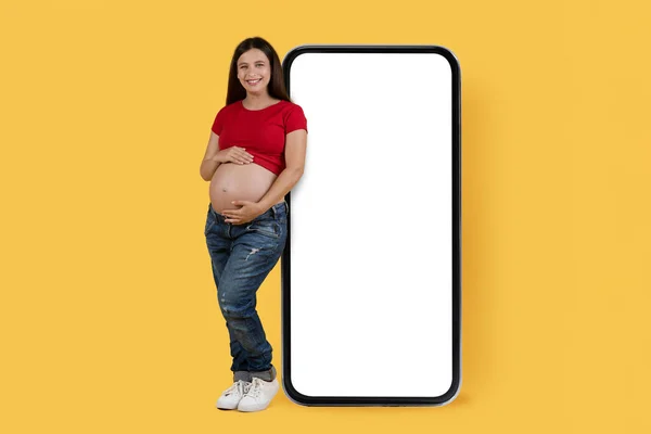 Mobile Mockup Smiling Young Pregnant Woman Leaning Big Smartphone Blank — Foto de Stock