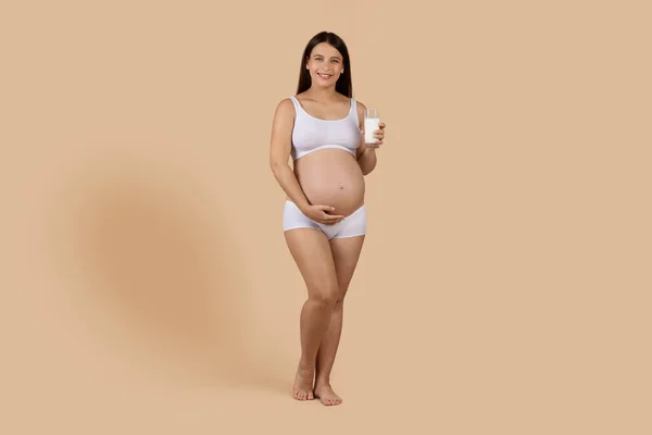 Beautiful Young Pregnant Woman Glass Milk Hand Posing Beige Background — Foto de Stock