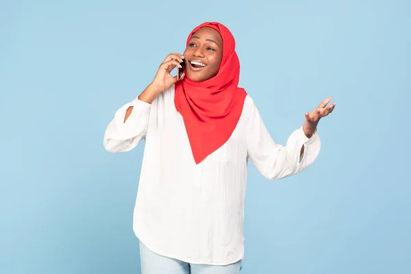 Emotional African American Muslim Woman Talking Cellphone Gesturing Standing Blue — Stock Photo, Image