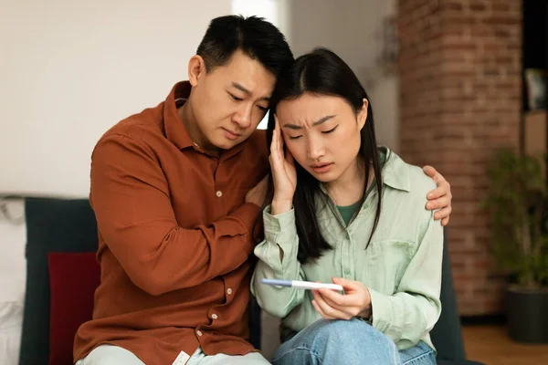 Upset Mature Asian Husband Comforting His Depressed Young Wife Negative — Photo
