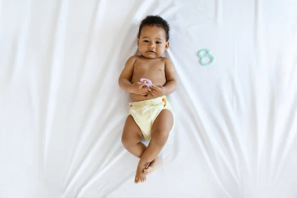 Top View Adorable African American Baby Playing Toy While Lying —  Fotos de Stock