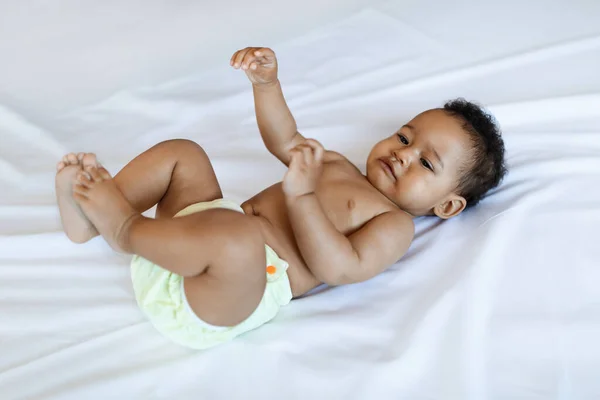 Closeup Shot Cute Little Black Baby Lying Bed Home Adorable — Foto Stock