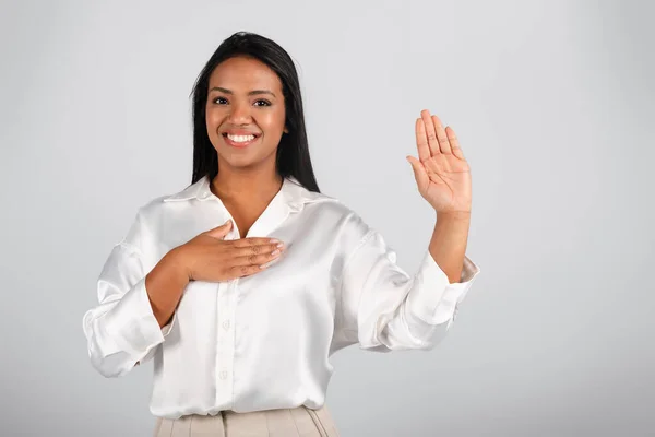 Happy Confident Millennial Black Businesswoman White Blouse Presses Hand Chest —  Fotos de Stock