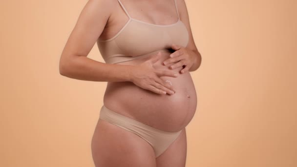 Skin Care Pregnancy Unrecognizable Pregnant Woman Underwear Rubbing Pampering Cream — Wideo stockowe