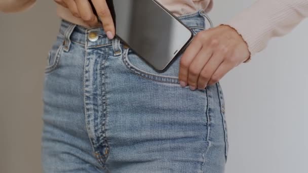 Close Shot Unrecognizable Slim Woman Putting Her Modern Smartphone Jeans — Stockvideo