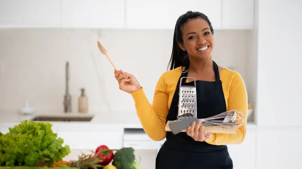 Smiling Young African American Female Apron Wooden Spoon Grater Whisk — Stockfoto
