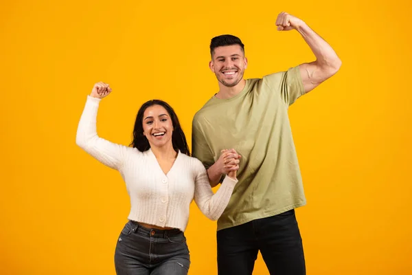 Smiling Millennial Arabic Husband Wife Holding Hands Show Biceps Hand —  Fotos de Stock