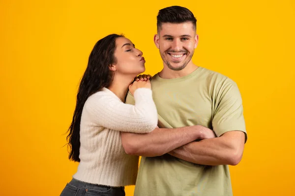 Smiling Handsome Millennial Middle Eastern Woman Kissing Tall Boyfriend Cheek — Fotografia de Stock