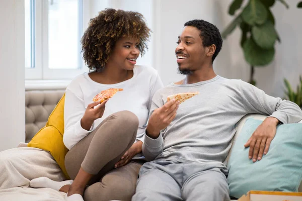 Happy Beautiful Millennial Black Lovers Sitting Couch Eating Pizza Having — Stockfoto