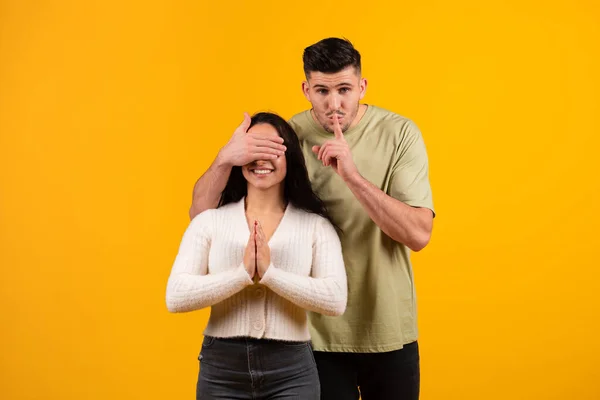 Cheerful Millennial Arabic Guy Closes Eyes Amazed Wife Makes Shhh — Fotografia de Stock