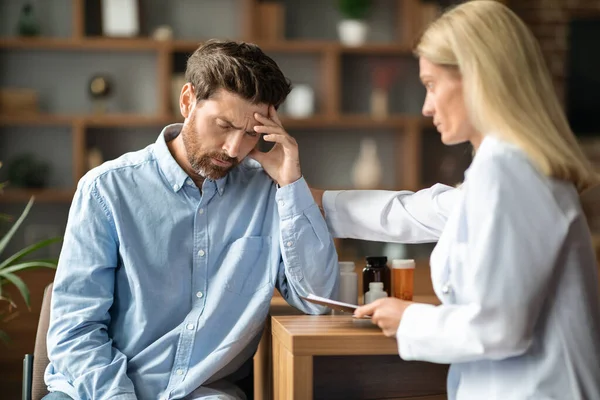 Bad Diagnosis Doctor Lady Comforting Depressed Male Patient Appointment Clinic — Stock Photo, Image