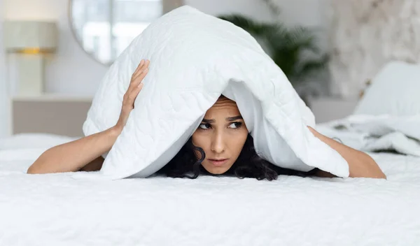 Sad Muslim Millennial Curly Female Woke Lies White Bed Covers — Zdjęcie stockowe