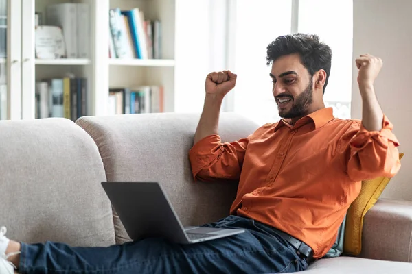Emotional Happy Young Middle Eastern Man Casual Sitting Couch Legs — Stockfoto