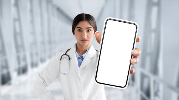 Serious Indian Female Doctor Uniform Showing Blank Smartphone Screen Camera — Stok fotoğraf