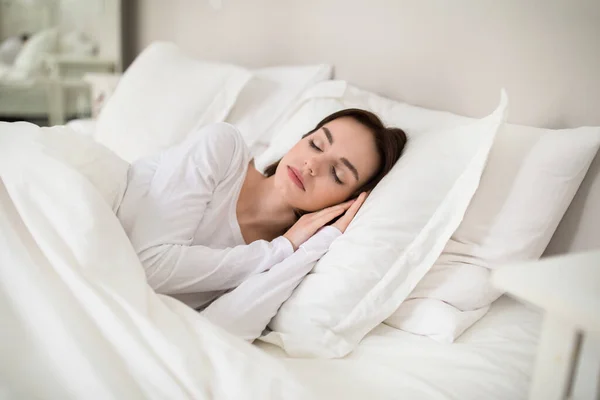 Beautiful Young Brunette Woman Sleeping Hands Her Head Soft Comfy — Zdjęcie stockowe
