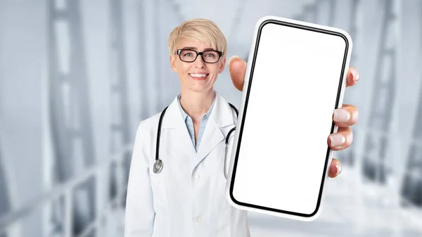 Smiling Doctor Lady Uniform Showing Big Smartphone Blank Screen Camera — Stok fotoğraf