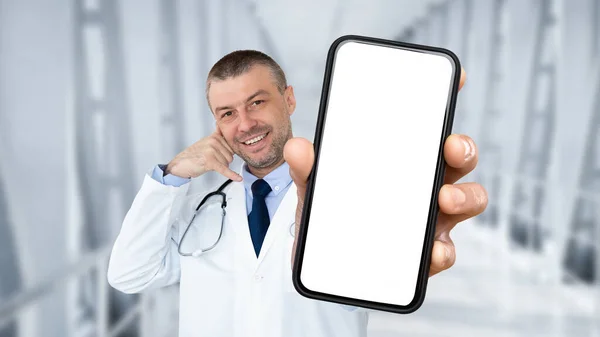 Smiling Middle Aged Male Doctor Showing Blank Smartphone Making Call — Stok fotoğraf