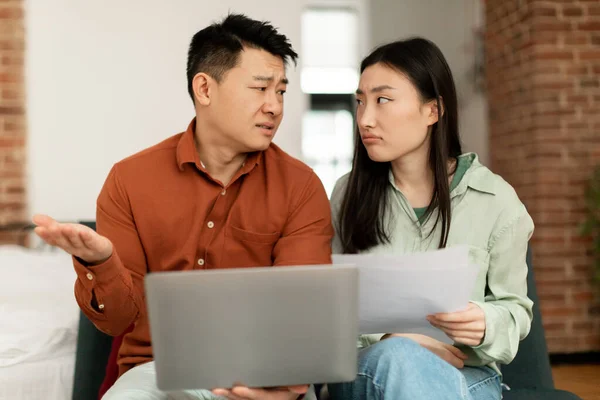 Financial Crisis Concept Upset Asian Couple Checking Documents Home Sitting — Photo