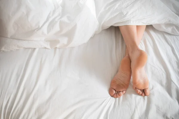 Legs Young European Woman Alone Lies White Bed Weekend Bedroom — Zdjęcie stockowe