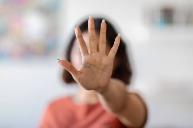 Unrecognizable Young Woman Covering Her Face With Open Palm, Female Showing Stop Gesture With Hand, Saying No To Violence Or Discrimination, Denying Proposal Or Offer, Selective Focus, Copy Space
