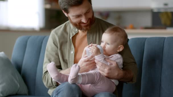 Baby Care Loving Young Father Holding His Little Daughter Hands — Vídeo de Stock