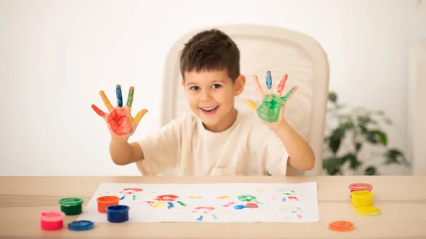 Cheerful Caucasian Little Child Sits Table Draws Finger Paints Painted — ストック写真