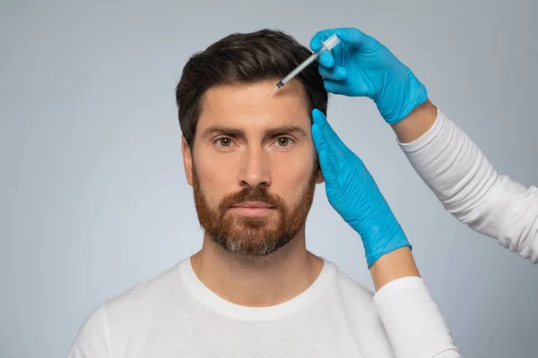 Male Patient Beautician Receiving Filler Injection Forehead Zone Willing Look — Stock Photo, Image
