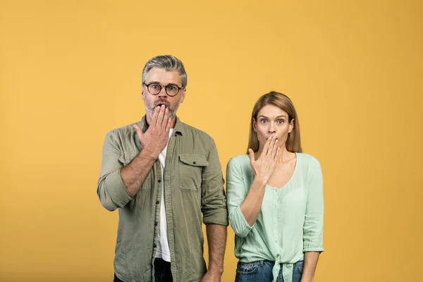 Shocked Middle Aged Caucasian Spouses Covering Mouths Shock Looking Camera — Fotografia de Stock