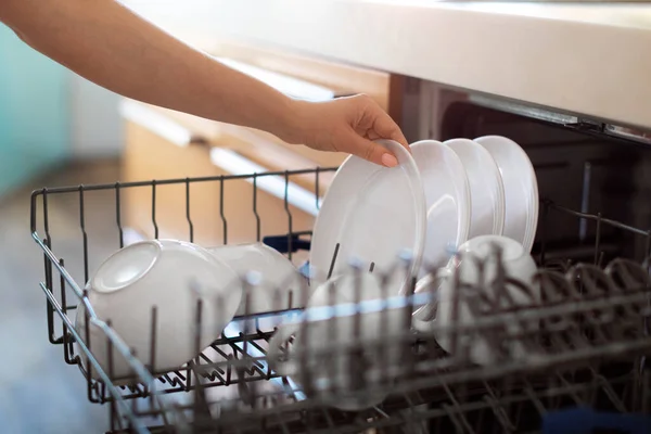Unrecognizable Woman Unloading Clean Dishes Dishwasher Machine Kitchen Female Hand — Foto de Stock
