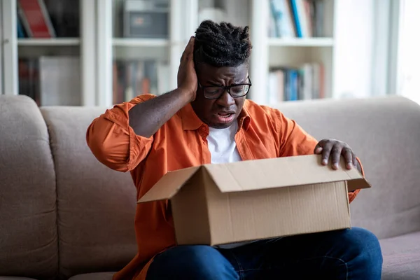 Disappointed Unhappy African American Young Guy Customer Sitting Couch Home — Stockfoto