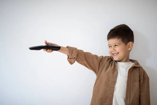 Cheerful Small European Boy Remote Control Plays Has Fun Shoots — Stock Photo, Image