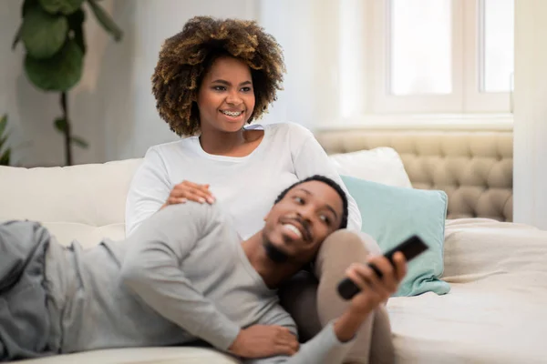 Positive Smiling African American Lovers Sitting Couch Cozy Living Room — Stockfoto