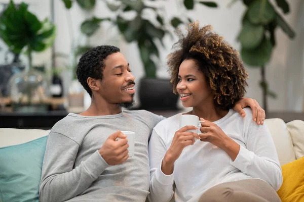 Beautiful Young African American Couple Pajamas Sitting Couch Cozy Living — Stockfoto