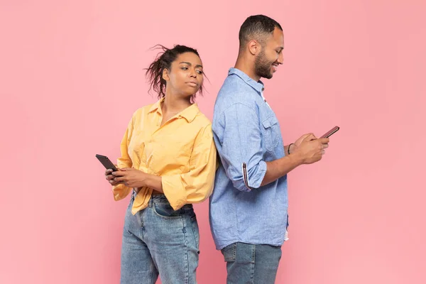 Curious Black Lady Trying Look Her Boyfriends Smartphone Smiling Guy — Foto de Stock
